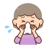 鼻をかむ高齢女性
